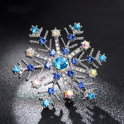 PWO Fitness Christmas gift snowflake brooch featuring vibrant blue rhinestones and intricate snowflake design.